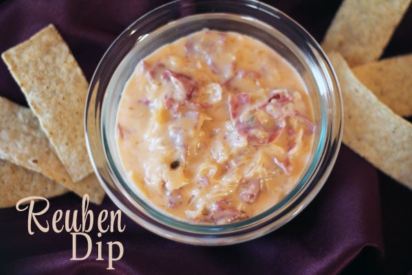 A slow cooker Reuben dip that is going to blow you away! Let the slow cooker turn your favorite sandwich into a deliciously creamy and cheesy dip!