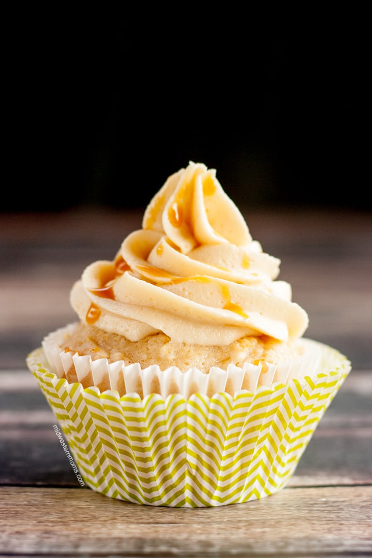 Delicious Caramel Apple Cupcakes. These apple cupcakes are topped with Caramel Frosting and drizzled with caramel. YUM!