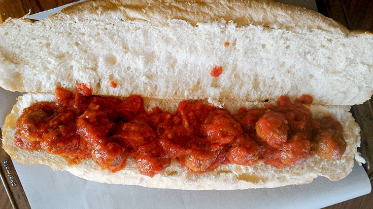 putting together a meatball sub