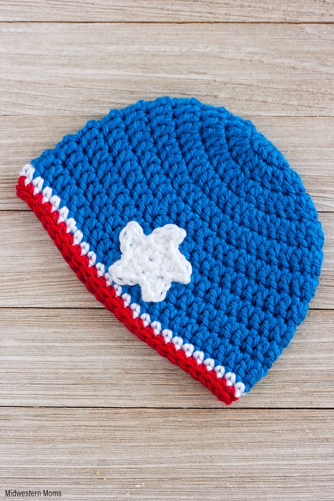A Simple Patriotic Crochet Baby Hat Pattern for a Girl! This red, white, and blue hat is finished off with a little star is perfect for showing patriotism! 