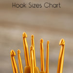 Several gold colored crochet hooks in different sizes.