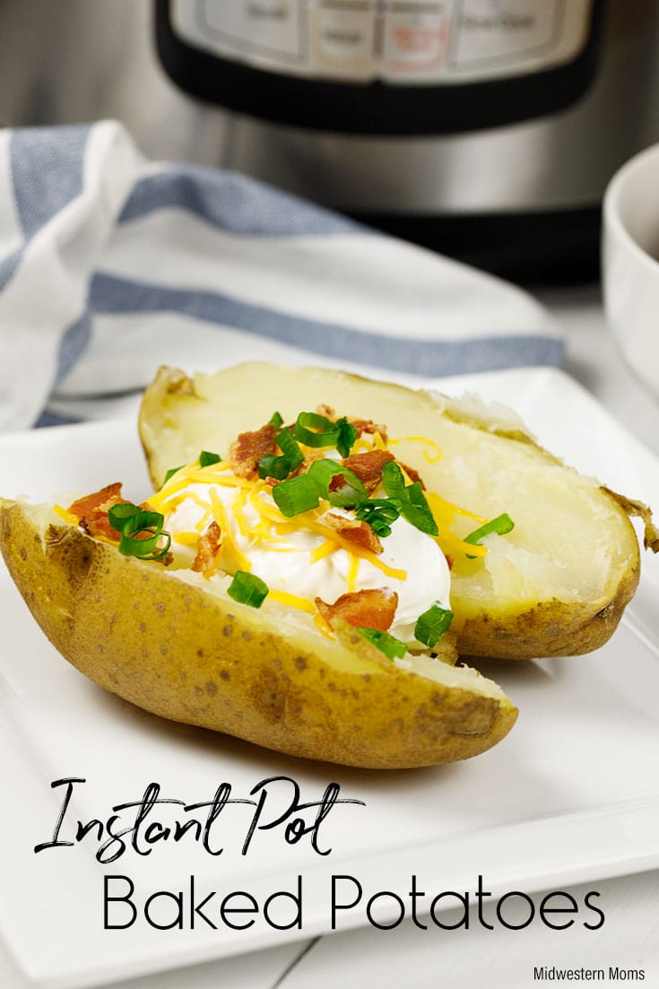 A baked potato with sour cream, cheese, and onions on top. This baked potato was made in an Instant Pot.