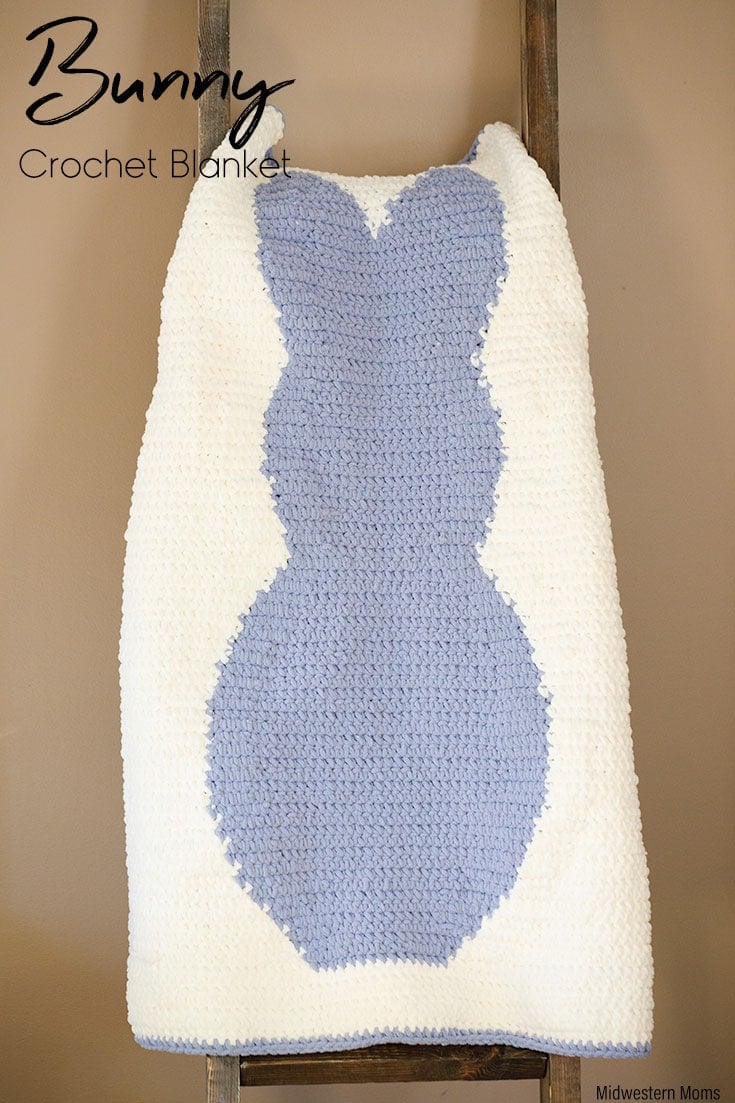 Bunny crochet blanket hanging on a blanket ladder.