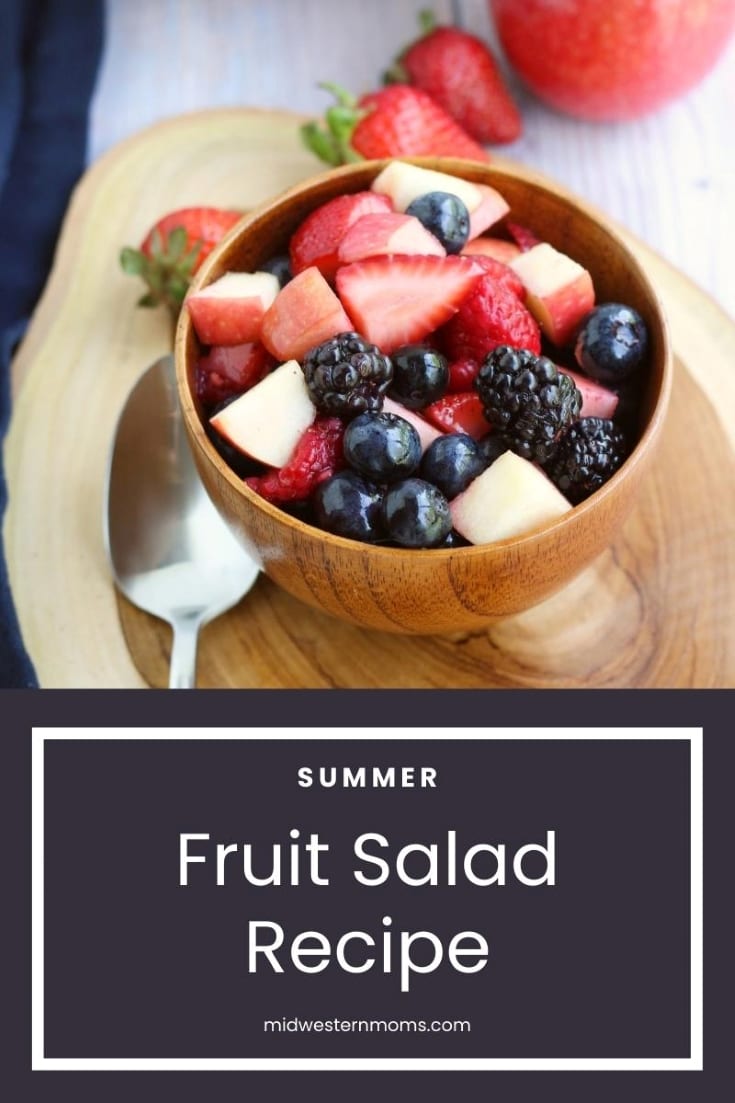 Wooden bowl with a summer fruit salad. 